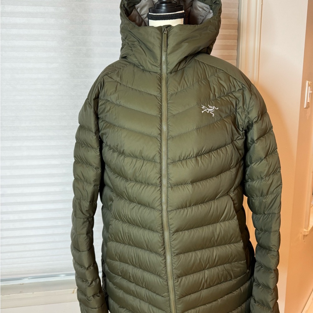 Arcteyx down-filled hoodie in dark khaki green.